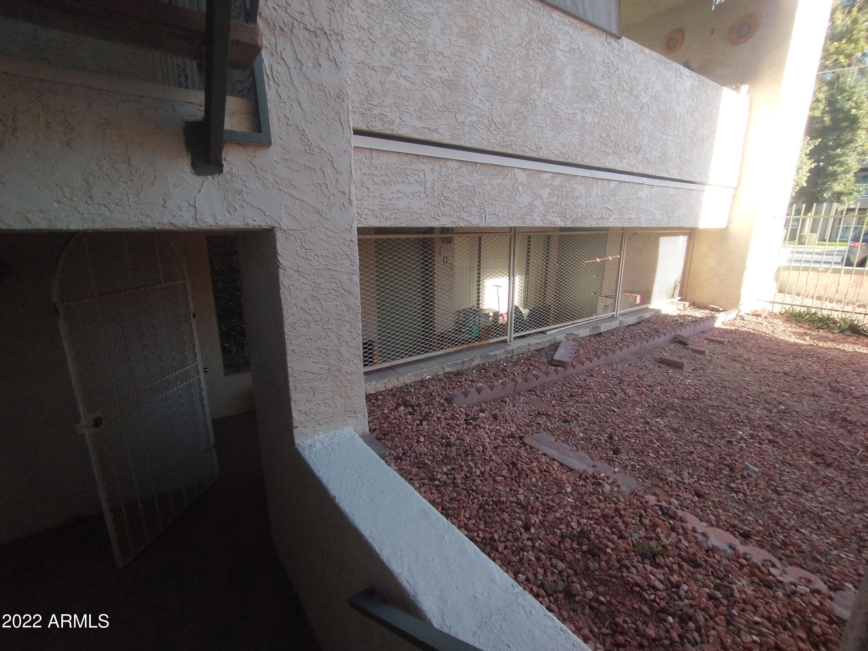 214 East Ruth Avenue, Unit 103 Phoenix, AZ 85020 - Photo 2 of 16 214 E Ruth-Fenced-In Front Patio