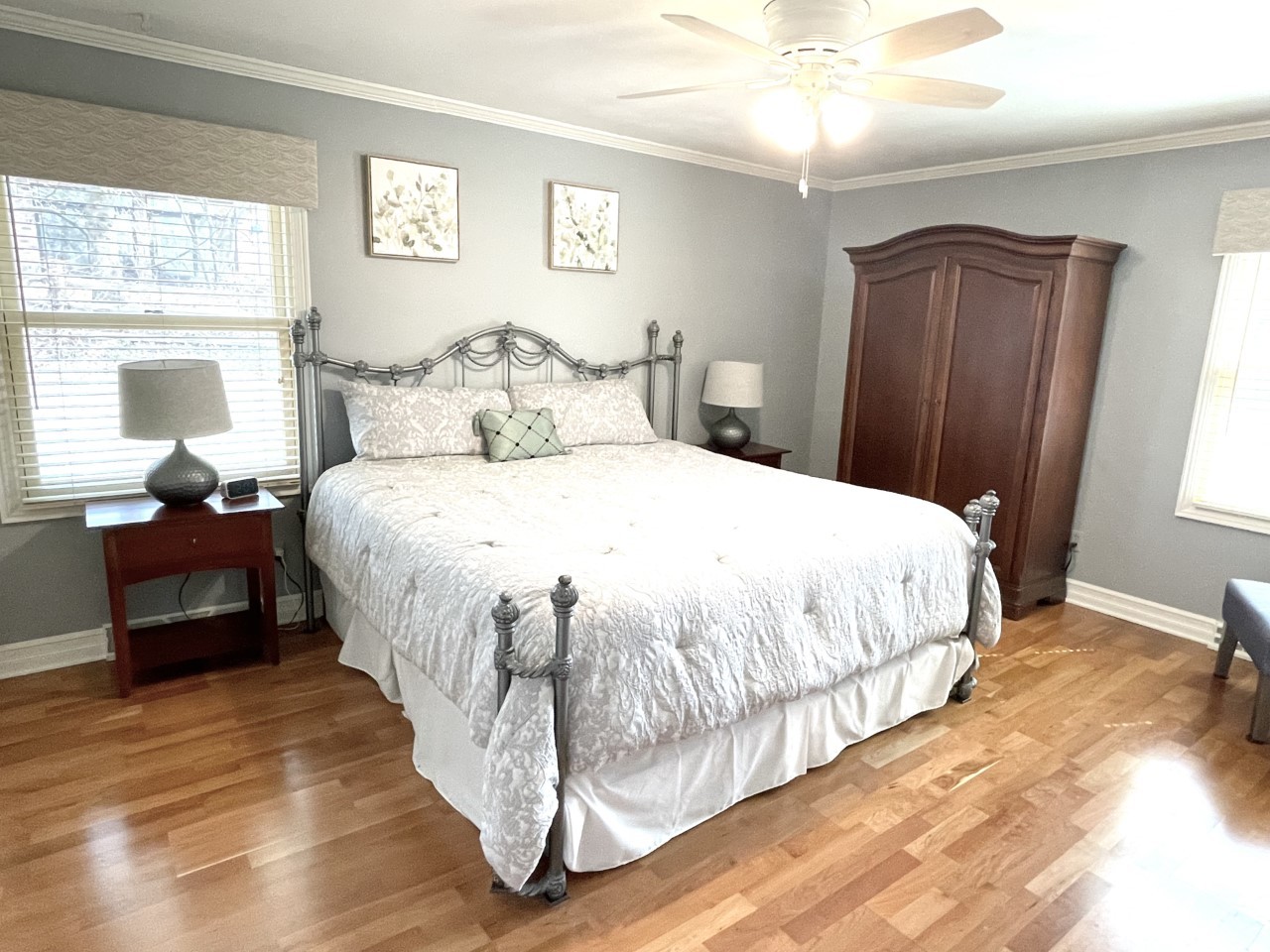 2583 East 259th Road Peru, IL 61354 - Photo 26 of 48 a bedroom with a bed and a chandelier