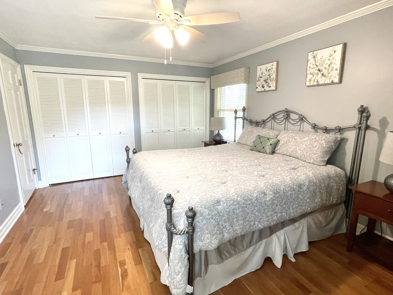 2583 East 259th Road Peru, IL 61354 - Photo 27 of 48 a spacious bedroom with a bed and a chandelier