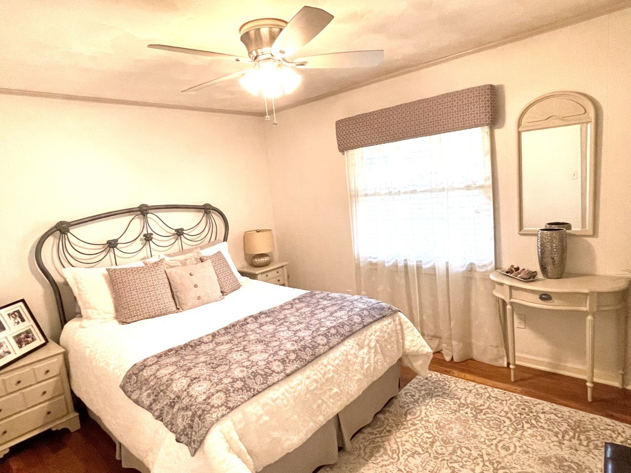 2583 East 259th Road Peru, IL 61354 - Photo 33 of 48 a bedroom with a bed a chandelier and a window
