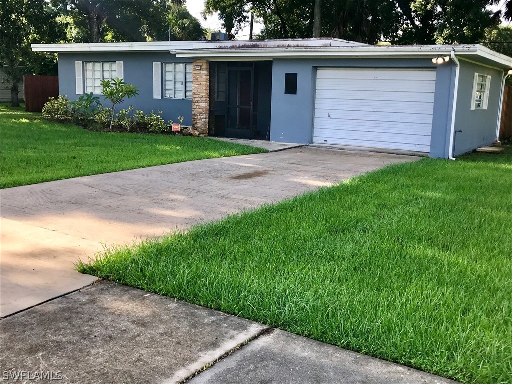 1606 Grove Avenue Fort Myers, FL 33901 - Photo 1 of 7 a front view of house with yard and green space