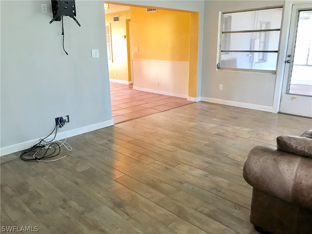 1606 Grove Avenue Fort Myers, FL 33901 - Photo 5 of 7 a view of a room with wooden floor and windows