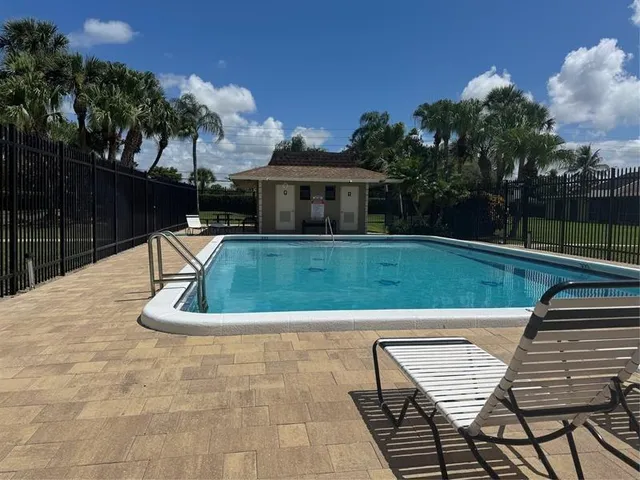 a view of house with car parked