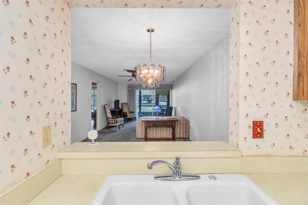 11204 Pembridge Court, Unit 4 Port Richey, FL 34668 - Photo 12 of 58 a bathroom with a bathtub sink and mirror
