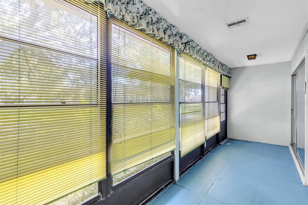 11204 Pembridge Court, Unit 4 Port Richey, FL 34668 - Photo 23 of 58 a view of an empty room with a large window