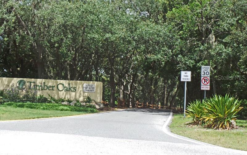 11204 Pembridge Court, Unit 4 Port Richey, FL 34668 - Photo 33 of 58 a sign that is on the side of a road