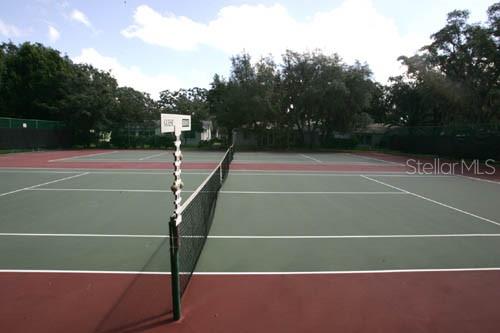 11204 Pembridge Court, Unit 4 Port Richey, FL 34668 - Photo 50 of 58 a view of a tennis court