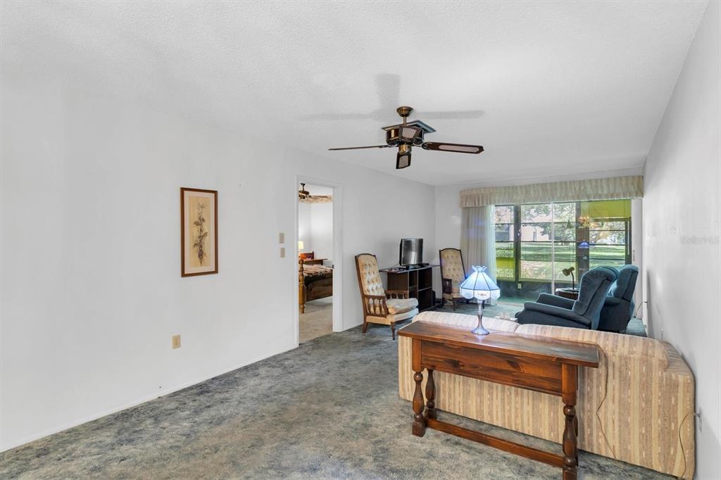 11204 Pembridge Court, Unit 4 Port Richey, FL 34668 - Photo 6 of 58 a living room with furniture