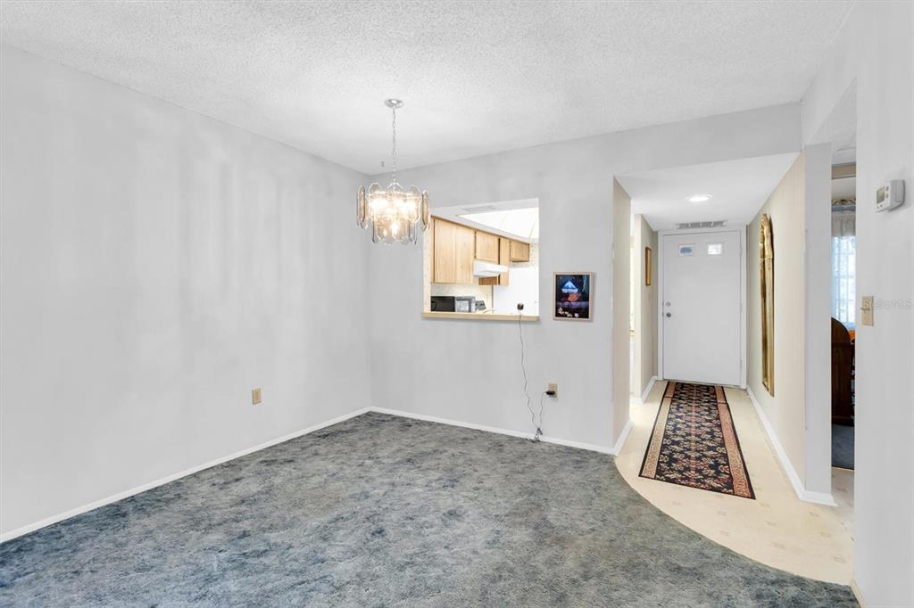 11204 Pembridge Court, Unit 4 Port Richey, FL 34668 - Photo 8 of 58 a view of an empty room and window