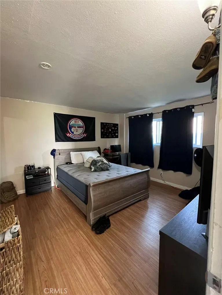 620 East 6th Street Azusa, CA 91702 - Photo 32 of 37 a living room with furniture and a flat screen tv