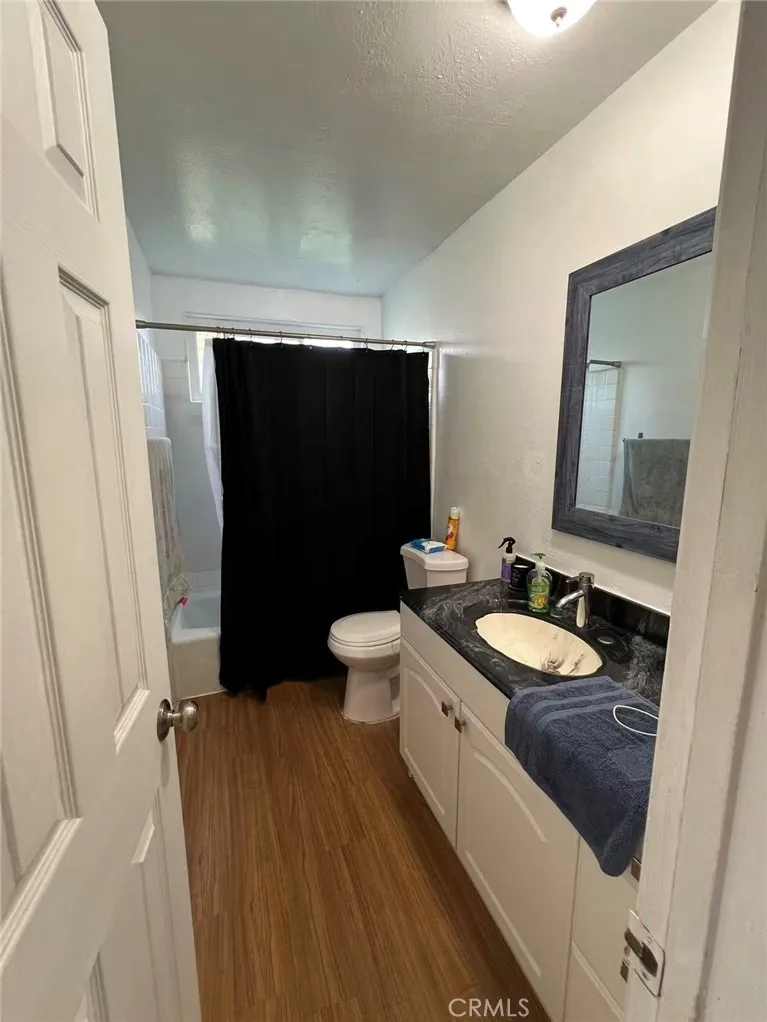 620 East 6th Street Azusa, CA 91702 - Photo 34 of 37 a bathroom with a double vanity sink toilet mirror and tub