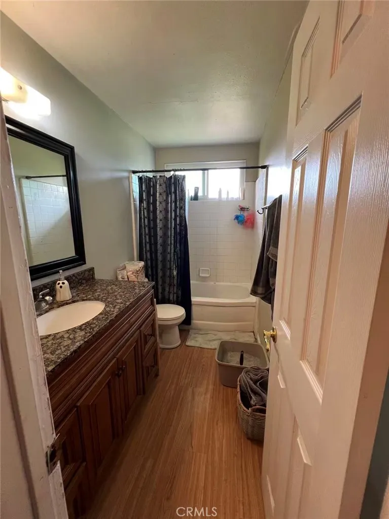 620 East 6th Street Azusa, CA 91702 - Photo 35 of 37 a bathroom with a sink a mirror and shower