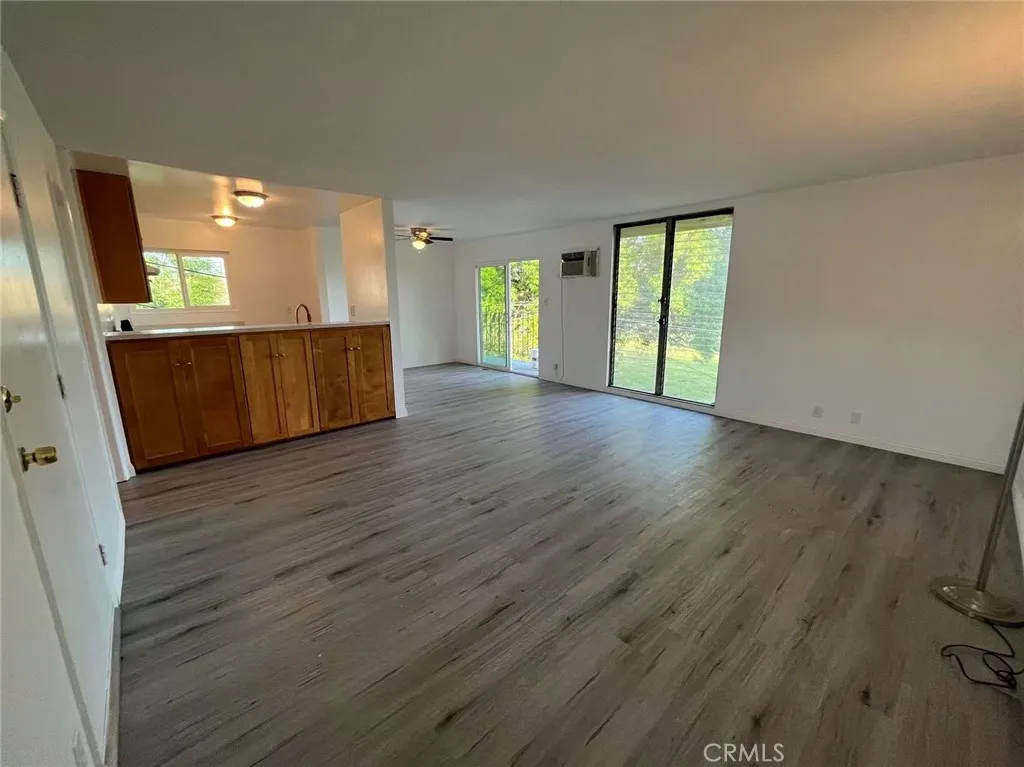 620 East 6th Street Azusa, CA 91702 - Photo 5 of 37 a view of a room with wooden floor and windows