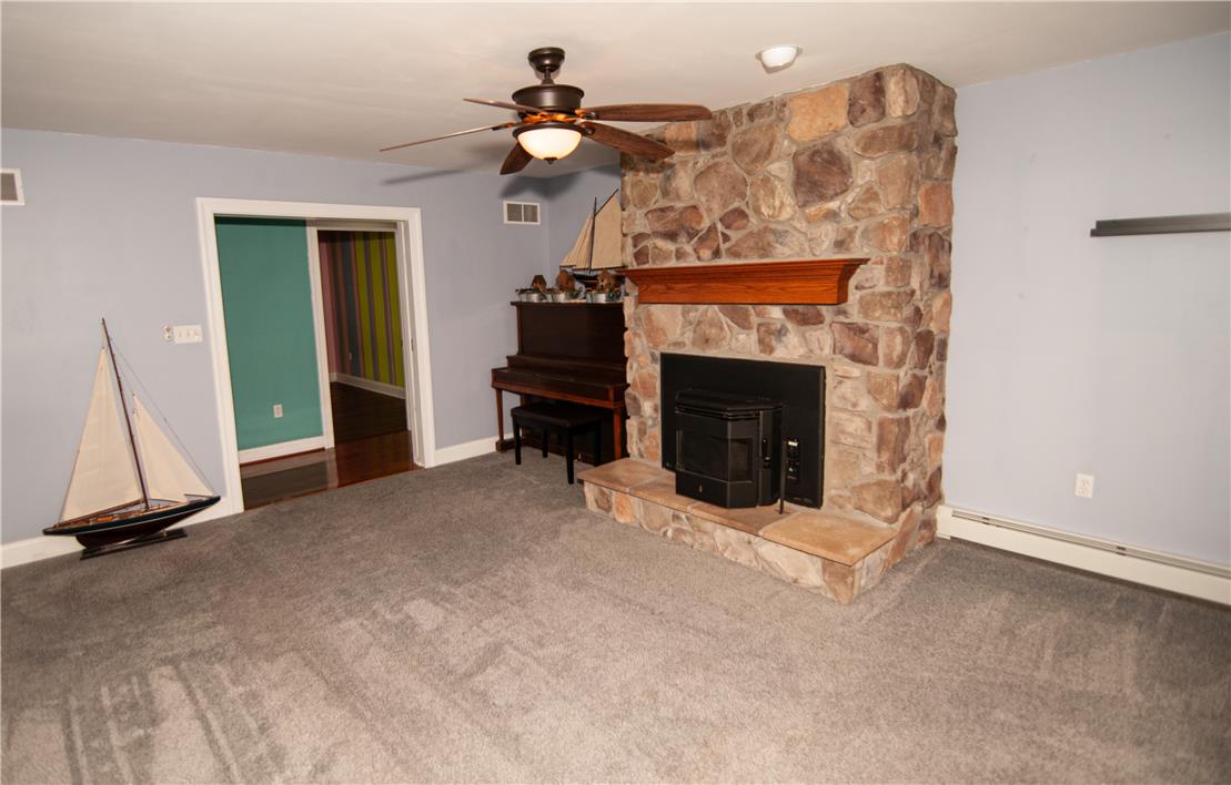 2202 High Meadow Road Coopersburg, PA 18036 - Photo 15 of 41 An impressive floor-to-ceiling stone fireplace serves as the centerpiece of this comfortable living space.