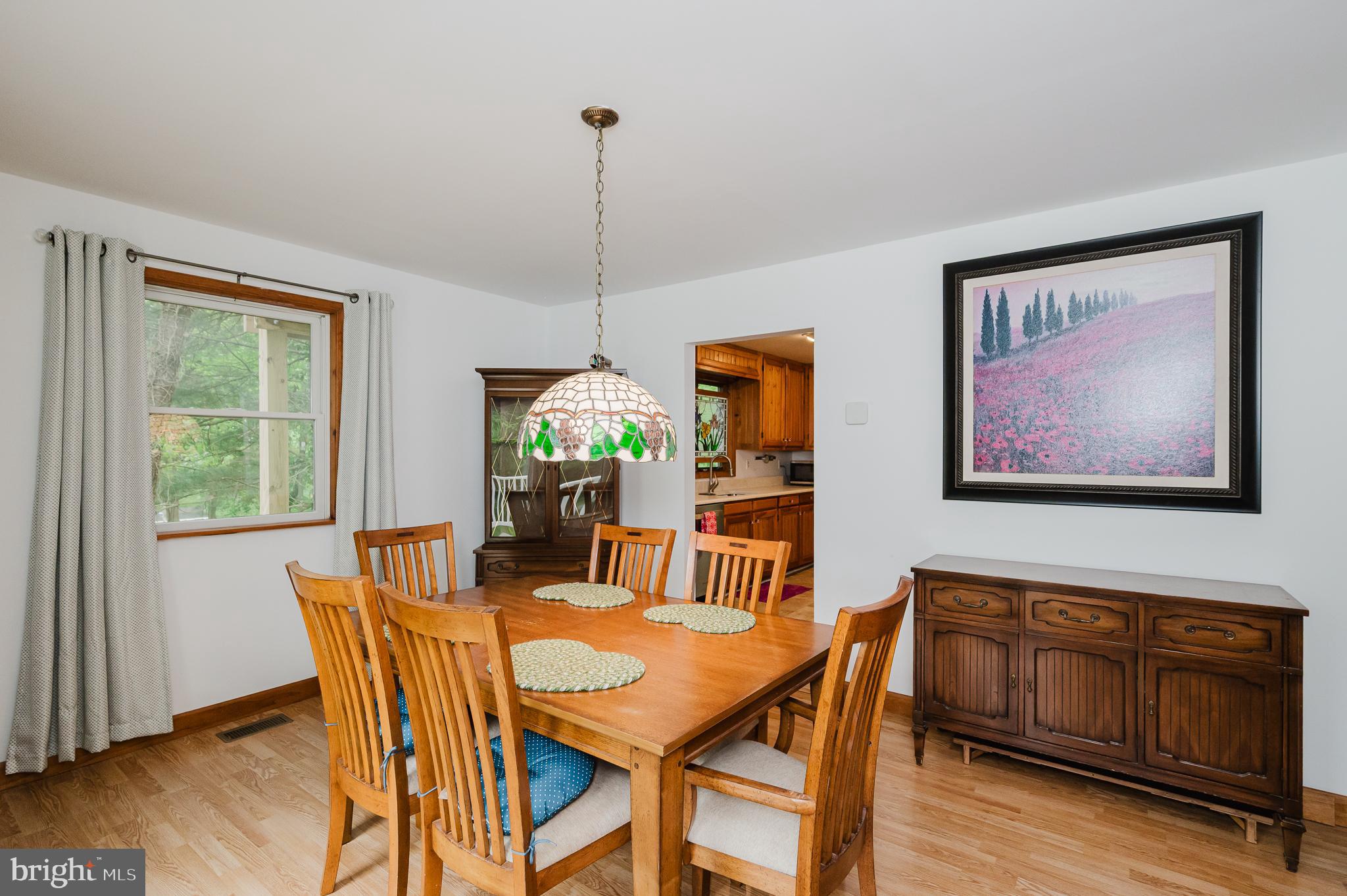 710 Magnolia Road Joppa, MD 21085 - Photo 6 of 58 a view of a dining room with furniture window and wooden floor