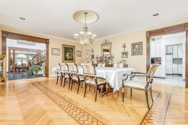 a view of a dining room with furniture wooden floor and chandelier