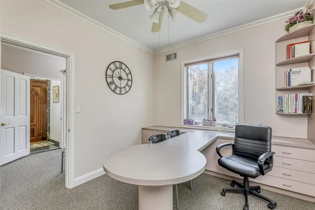 a workspace with furniture and window