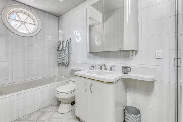 a bathroom with a sink a toilet and a bathtub