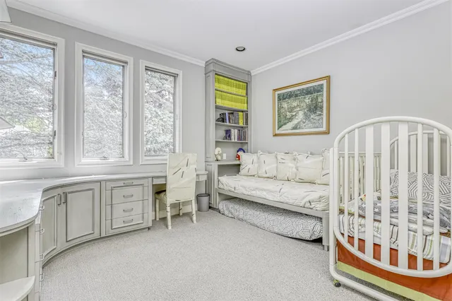 a living room with furniture and entry gate