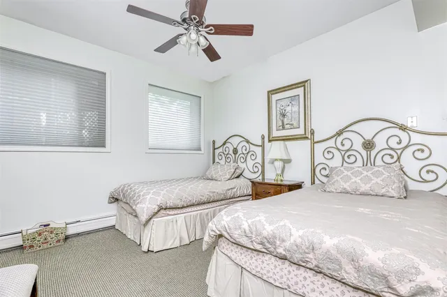 a bedroom with double bed and a window