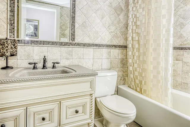 a bathroom with a toilet a sink and a bathtub