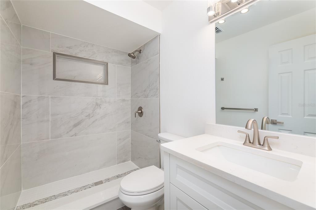 4975 Fay Boulevard Cocoa, FL 32927 - Photo 15 of 35 a bathroom with a sink toilet and shower