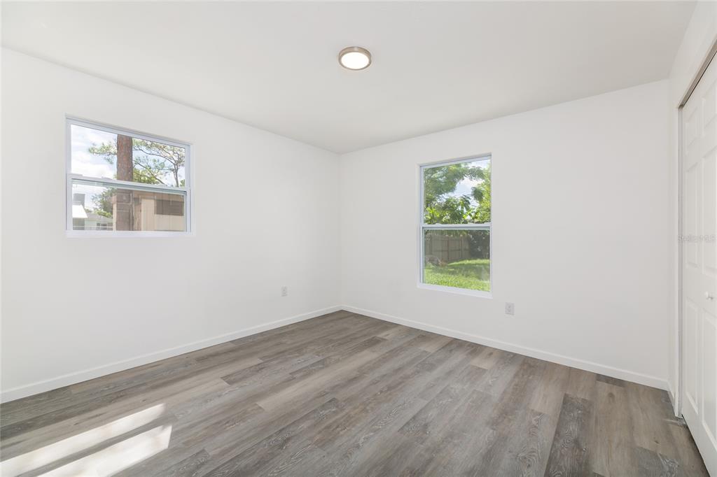 4975 Fay Boulevard Cocoa, FL 32927 - Photo 18 of 35 a view of room with window and hardwood floor