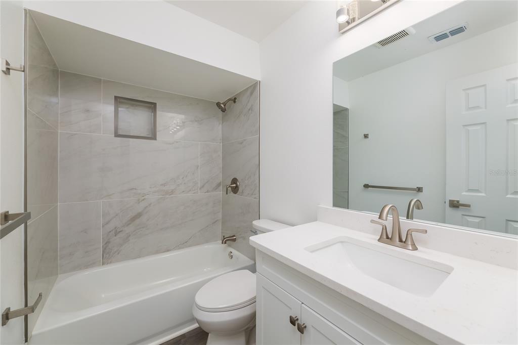 4975 Fay Boulevard Cocoa, FL 32927 - Photo 20 of 35 a bathroom with a sink toilet and shower