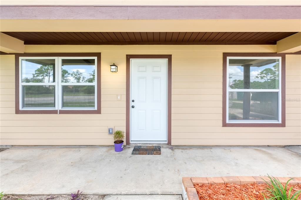 4975 Fay Boulevard Cocoa, FL 32927 - Photo 2 of 35 a front view of a house with a garage