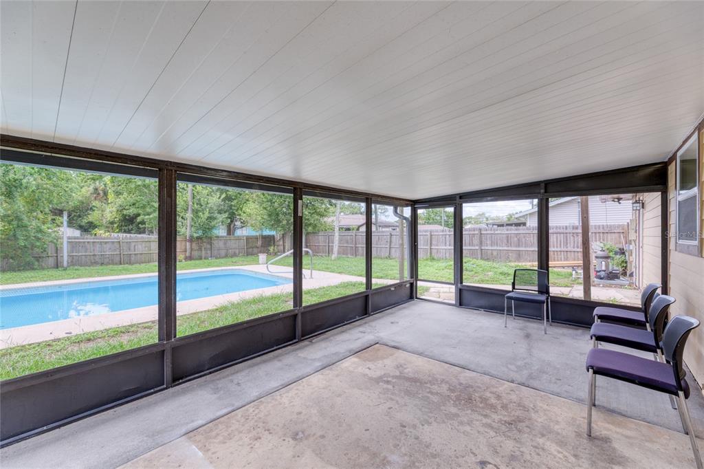 4975 Fay Boulevard Cocoa, FL 32927 - Photo 23 of 35 a view of a furniture and floor to ceiling window