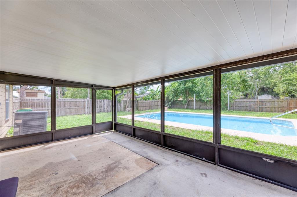 4975 Fay Boulevard Cocoa, FL 32927 - Photo 24 of 35 a view of an empty room with wooden floor and a balcony