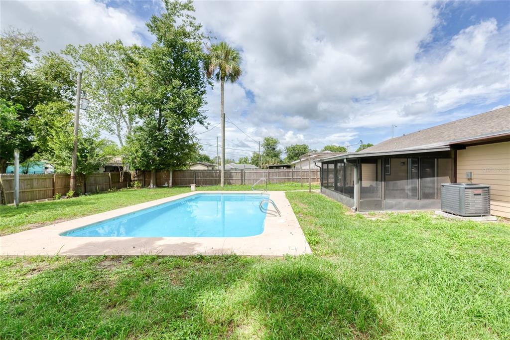 4975 Fay Boulevard Cocoa, FL 32927 - Photo 25 of 35 a view of a backyard with swimming pool