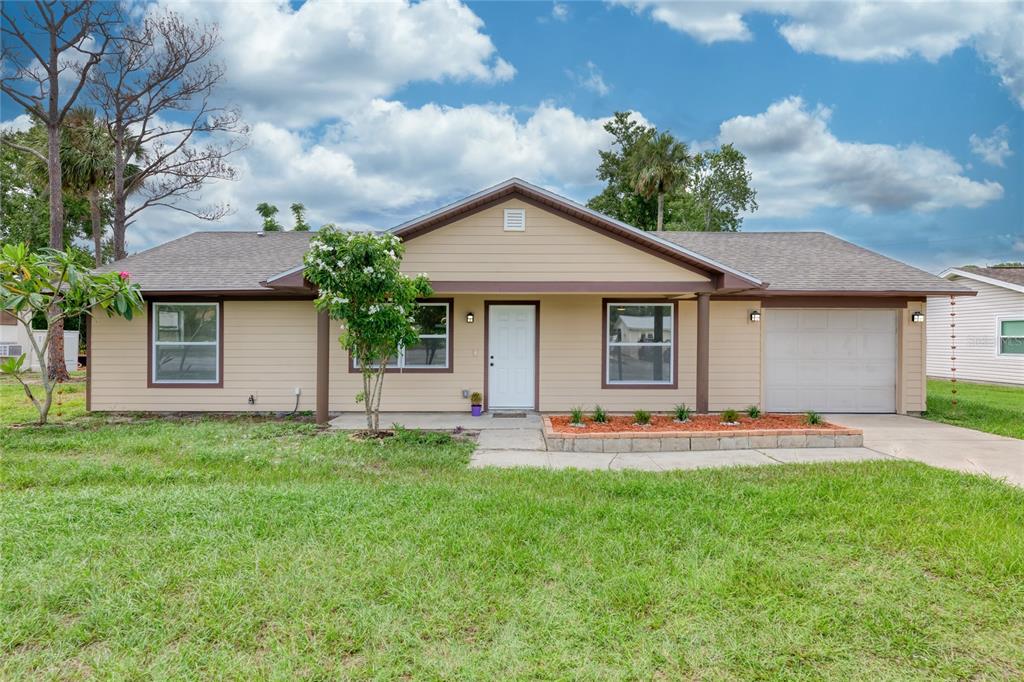 4975 Fay Boulevard Cocoa, FL 32927 - Photo 33 of 35 a front view of house with yard and green space