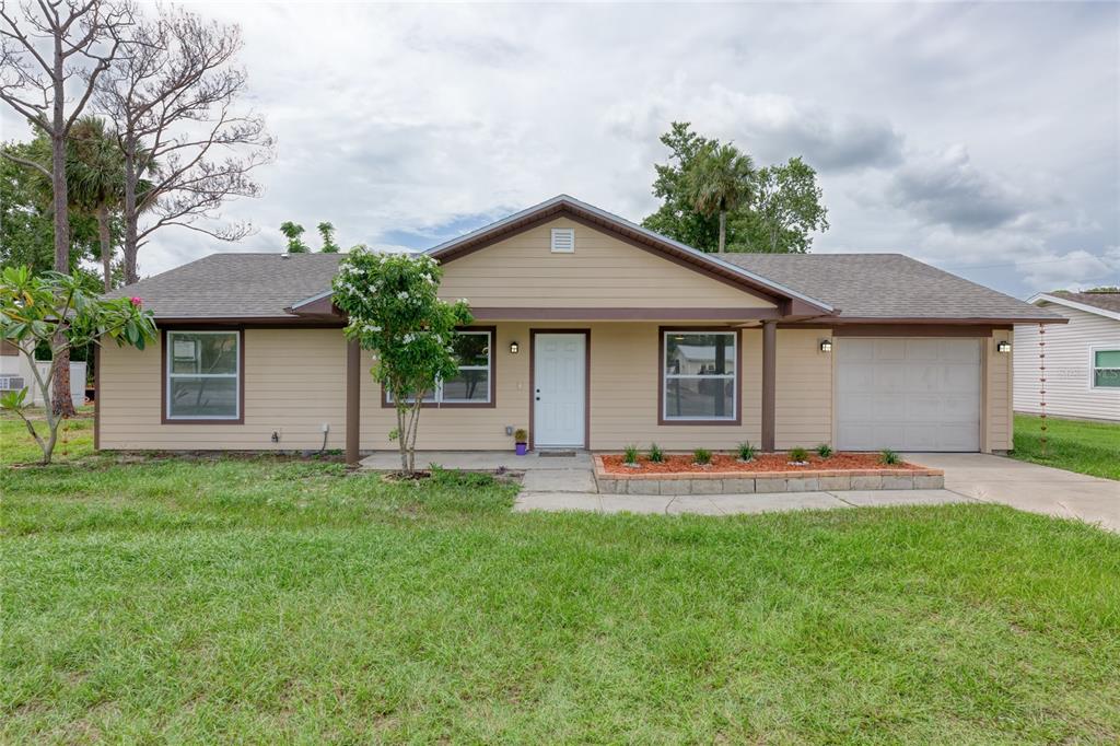 4975 Fay Boulevard Cocoa, FL 32927 - Photo 34 of 35 a front view of house with yard and green space