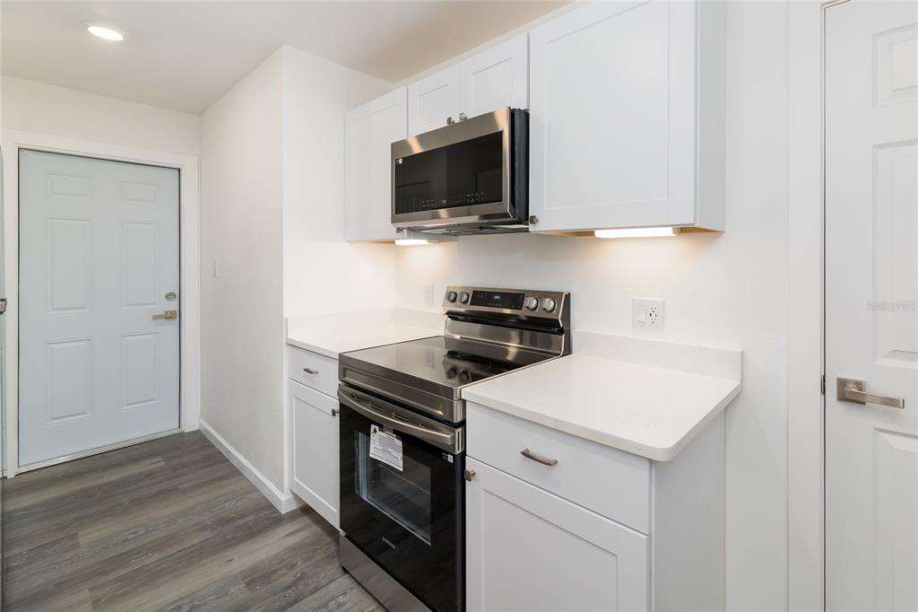 4975 Fay Boulevard Cocoa, FL 32927 - Photo 10 of 35 a kitchen with a stove and a microwave