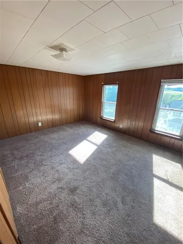 a view of wooden floor and staircase in a room