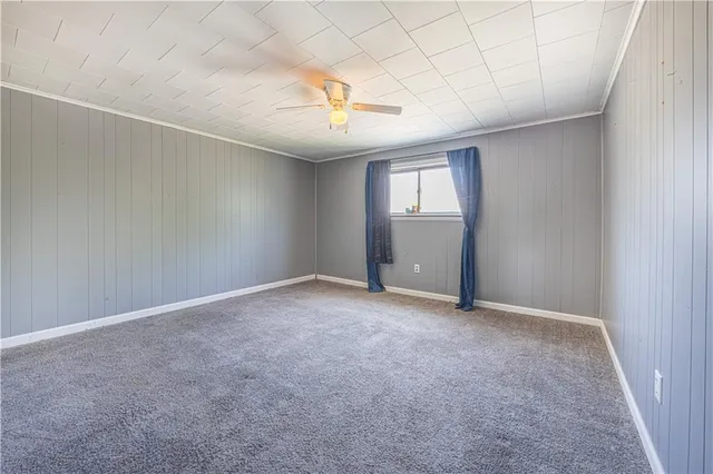 an empty room with windows and entrance