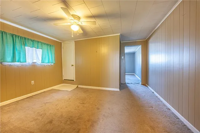 an empty room with windows and entrance