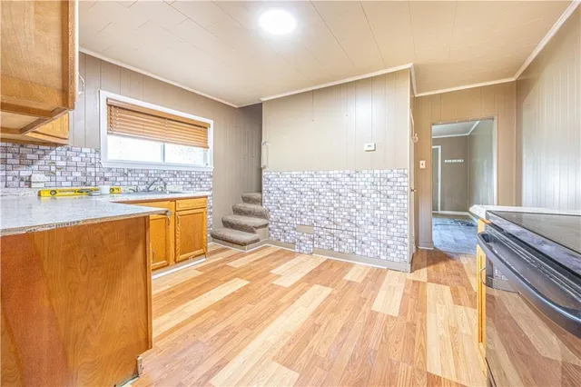 a spacious bedroom with a bed and a cabinets