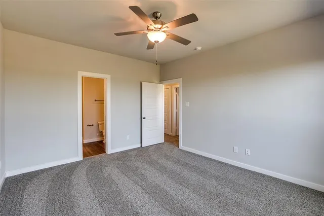 a view of a big room with carpet