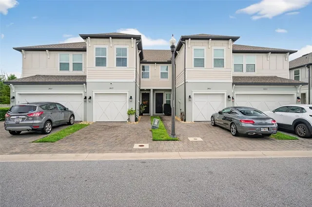 a view of a car parked in front of a house