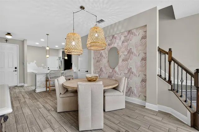 a bathroom with a tub shower sink and mirror