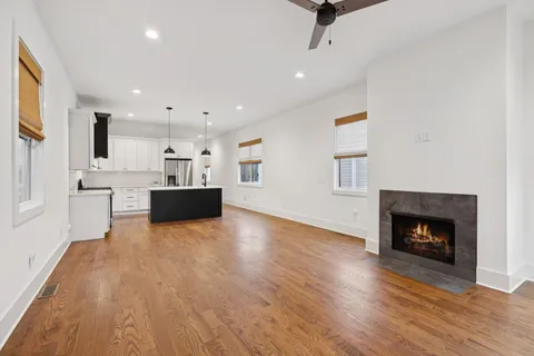a bathroom with a double vanity sink toilet and a mirror