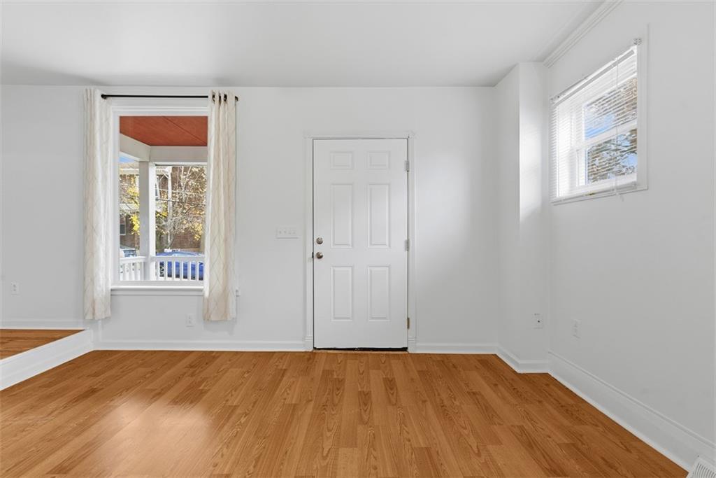 620 Montclair Street Pittsburgh, PA 15217 - Photo 5 of 40 a view of an empty room with wooden floor and a window
