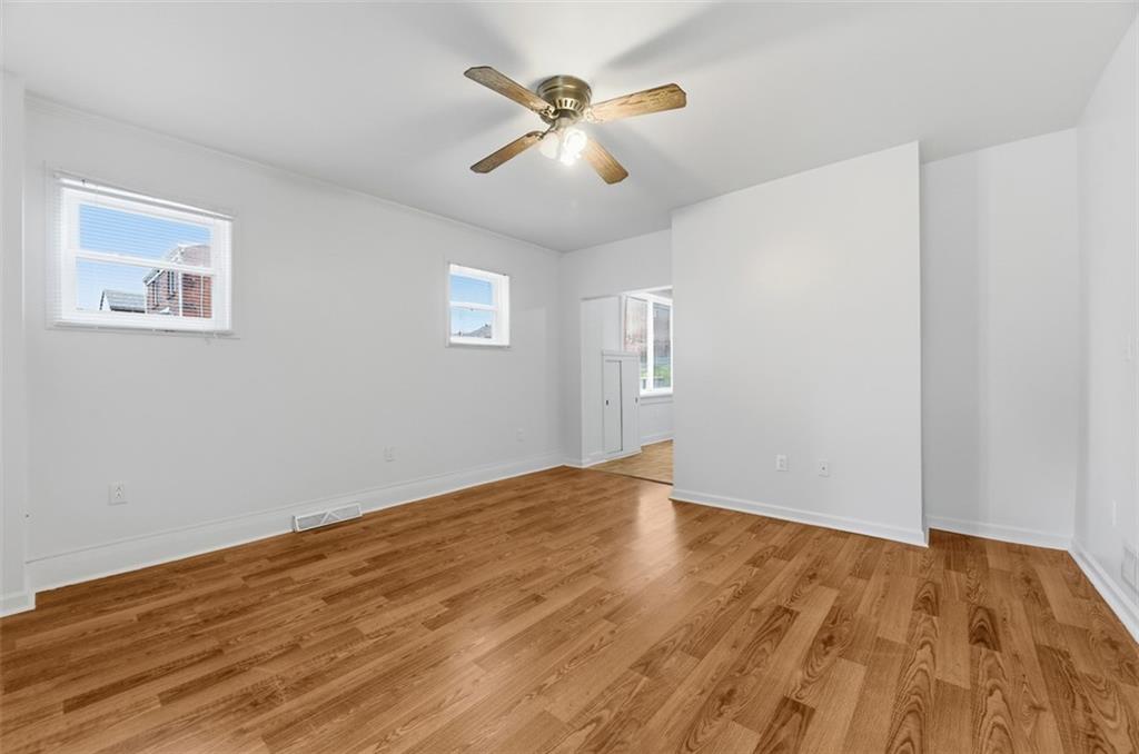 620 Montclair Street Pittsburgh, PA 15217 - Photo 8 of 40 an empty room with wooden floor and windows
