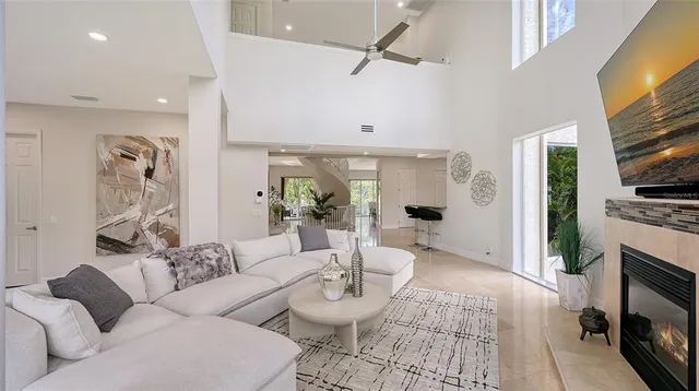 a living room with furniture and a potted plant
