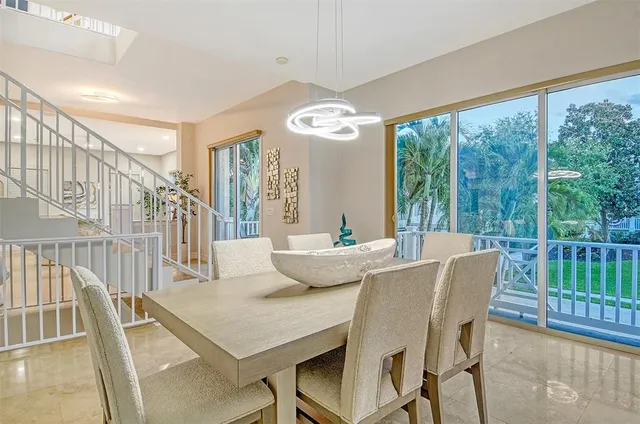 a view of a hallway with paintings on the wall