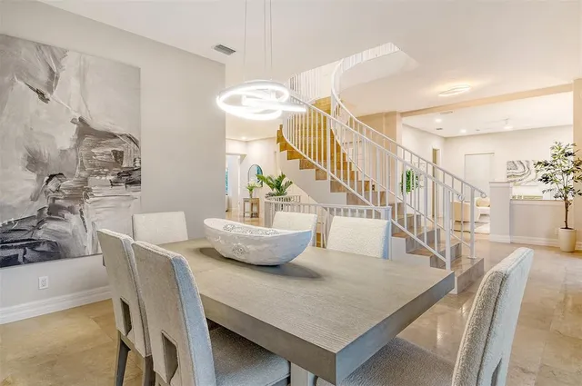 a view of entryway with wooden floor and windows