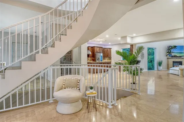 a bathroom with a granite countertop sink and a bathtub