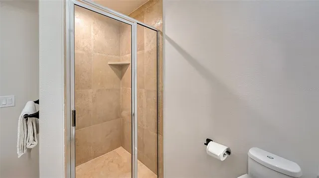 a bathroom with a tub a sink and mirror